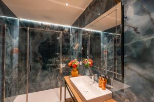 a bathroom with a sink and a shower at Hotel San Samuele in Venice