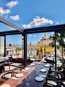 a table on a balcony with a view of the city at RUZ Hotels in Istanbul