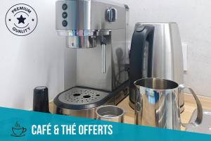 a coffee maker sitting on a counter next to a mixer at Evasions-Dérobade, centre-ville, gare in Auterive