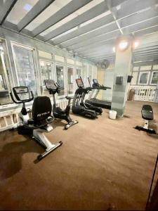 a gym with several exercise bikes in a room at Sandy Toes Getaway in Hilton Head Island