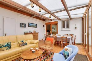 a living room with a couch and a table at Phare - SAINT HILAIRE DE RIEZ in Saint-Hilaire-de-Riez