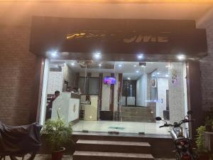 a store front with a sign on the front of it at Grand Almada Inn in Lucknow
