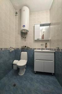 a bathroom with a toilet and a sink at Hristean Apartment Petrich in Petrich