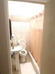 a bathroom with a toilet and a sink at Olive Breeze III in Runaway Bay +5 photos