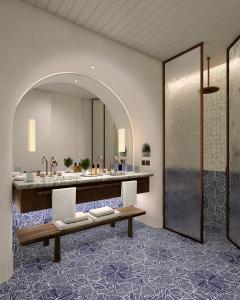 a bathroom with a sink and a mirror at Jumeirah Capri Palace in Anacapri +141 photos