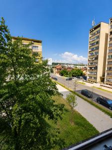 a view of a street in a city with buildings at Alex City Apartment Gabrovo in Gabrovo