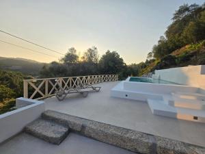 a view from the roof of a house with a bench at Casa Lage da Pena in Geres