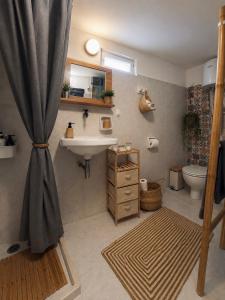 a bathroom with a sink and a toilet at Forrest Guesthouse in Polídhroson +63 photos