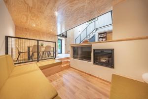 a room with a fireplace and a dining room at Casa do primo Zeca in Ponte da Barca