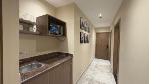 a kitchen with a sink and a counter top at Dar Pyramids Boutique in Cairo