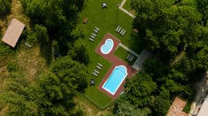 an aerial view of a yard with a swimming pool at Hotel de La Trucha in Villarluengo +37 photos