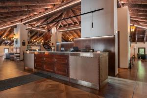 a lobby with a reception desk in a building at Hotel de La Trucha in Villarluengo