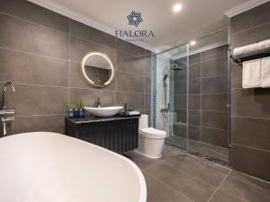 a bathroom with a sink and a toilet and a shower at Halora Kairos Cruise in Ha Long +34 photos
