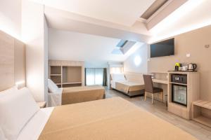 a hotel room with a bed and a living room at Hotel Miramonti in Turin +118 photos
