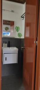 a bathroom with a sink and a toilet and a door at RC Hutspot Tourist Inn in San Francisco +121 photos