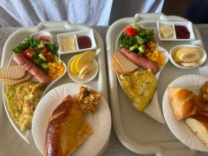 a tray with three plates of food on it at Qas-saQ in Türkistan