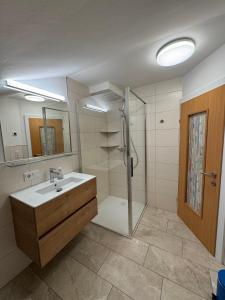 a bathroom with a shower and a sink and a shower at Haus Vera in Zell am See +54 photos