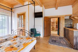 a bedroom with a bed in a room at Ad Matrem in Zubrzyca Dolna