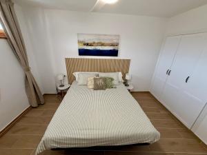 a bedroom with a large bed in a room at Pool View Apartment Garden City in Costa de Adeje