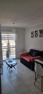 a living room with a couch and a coffee table at B & V departamentos in San Salvador de Jujuy