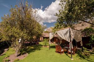 a tent in the yard of a house at San Agustin Monasterio de la Recoleta in Urubamba