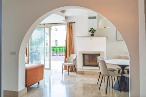 an archway in a living room with a table and chairs at Leda Beach Villa in Polis Chrysochous