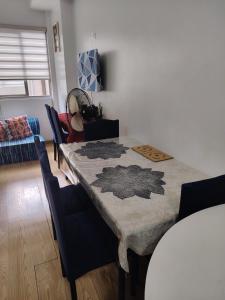 a dining room with a table and some chairs at Tala Transient House in Baguio