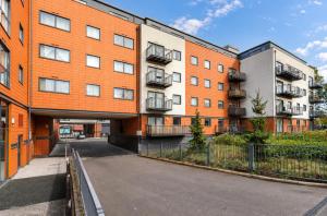 an external view of an apartment building at Roomspace Serviced Apartments - Capitol Square in Epsom