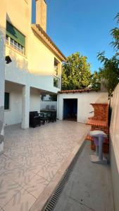 a patio of a house with a building at Recanto da Paz in Pombal