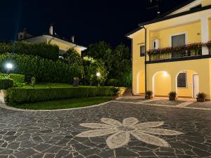 a cobblestone driveway in front of a house at night at Villa Grazia in Oliveto Citra