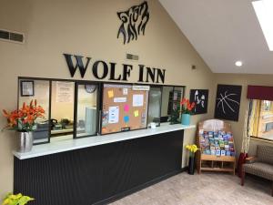 a wolf inn store with a sign on the wall at Wolf Inn Hotel in Sandusky