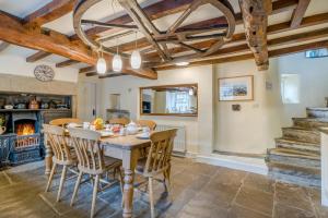 a kitchen and dining room with a table and chairs at 2 Bed in Askrigg oc-ds778 in Askrigg