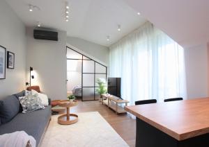 a living room with a couch and a table at Otepää Residence in Otepää