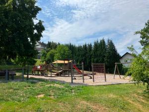 a park with a playground with a swing at Ferienhaus Louis Philippe in Altlay