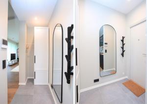 a hallway with mirrors on the wall in a house at Otepää Residence in Otepää +177 photos