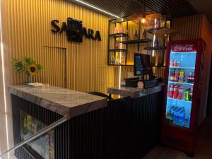 a soda station with a soda machine in a store at Hotel sahara in Medellín