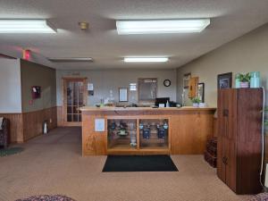 a waiting room with a counter in a room at Drayton Inn in Drayton