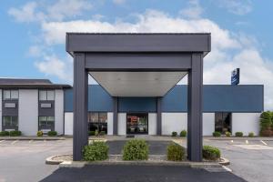 a building with a black structure in a parking lot at Best Western Shepherdsville-Louisville South Hotel in Shepherdsville