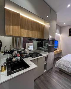 a kitchen with a stove and a counter top at Didi's Apartment in Lekki