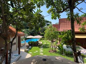 a view of the garden from the house at Flow Hua Hin - Ice Bath and Villa in Hua Hin +9 photos
