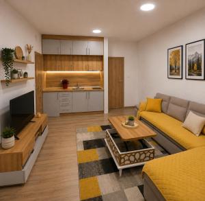 a living room with a couch and a table at Apartman Trifko in Pale