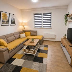 a living room with a couch and a table at Apartman Trifko in Pale
