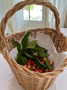 a basket filled with berries and greens on a table at Perseïdes in Saignon