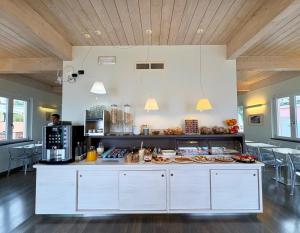 a kitchen with a counter with food on it at Hotel Delle Rose in Bonassola