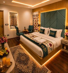 a hotel room with a large bed and a living room at Hotel Gulsar pahalgam in Pahalgām