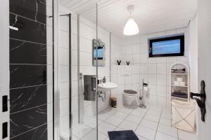 a bathroom with a shower and a sink at Schwarzwaldglück in St. Blasien +27 photos