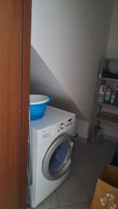 a washing machine with a bowl on top of it at 95 by Le Suite in Lugo