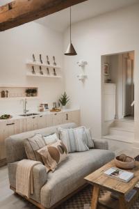 a living room with a couch and a table at Kennet in Marlborough