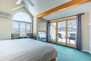 a bedroom with a large bed and a balcony at Nordic Village Condominium Resort in Jackson +83 photos