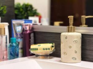 a white soap dispenser sitting on top of a counter at Plavo oko in Sarajevo +55 photos